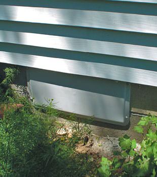 A gray crawl space vent cover in Peachtree Corners