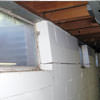 A foundation showing severe inward buckling along the windows in a Rome home.