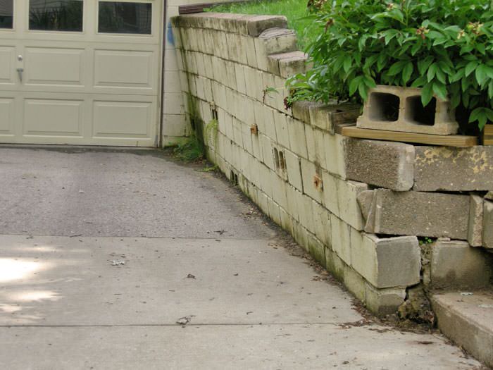 a failing retaining wall around a driveway in Atlanta