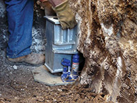 Securing a foundation footing bracket for a foundation repair system in Kennesaw.