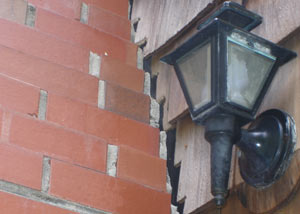 A tilting chimney in Peachtree Corners showing serious foundation damage.