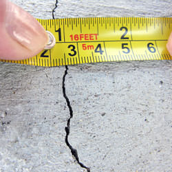 A crack in a poured concrete wall that's showing a normal crack during curing in Acworth