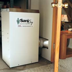 A basement dehumidifier with an ENERGY STAR® rating ducting dry air into a finished area of the basement  in Acworth