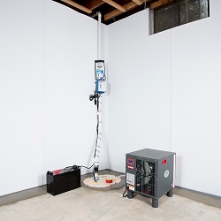 Sump pump system, dehumidifier, and basement wall panels installed during a sump pump installation in Dalton